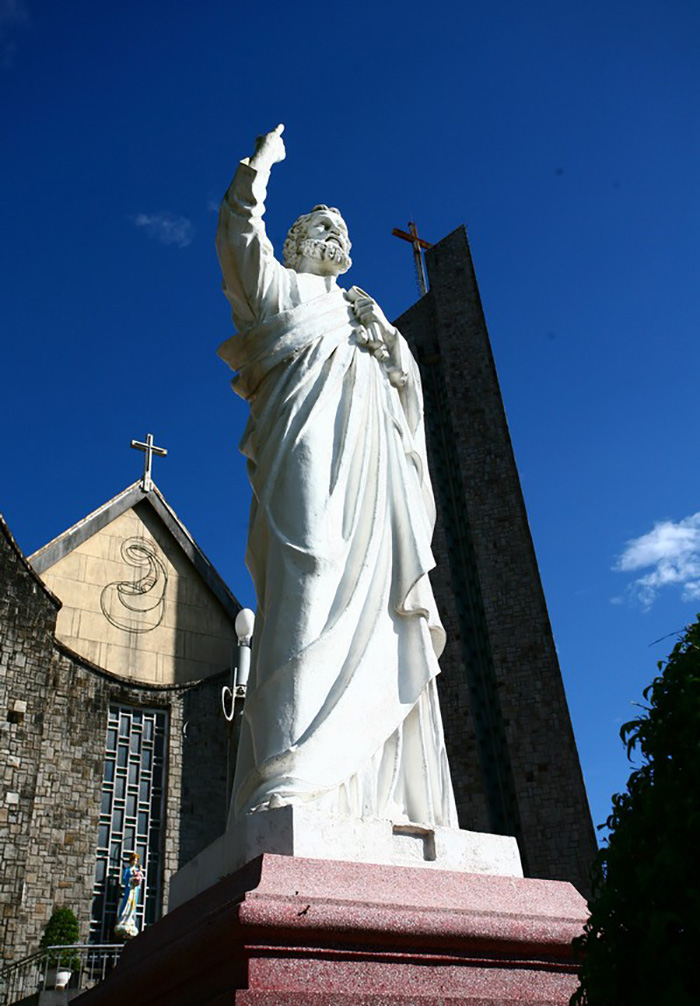 Statue of St. Peter in front, left of the church (in the direction of looking from outside).