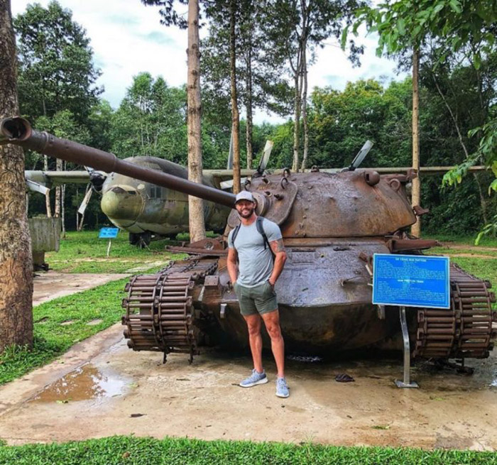 Visiting the relics of Cu Chi tunnels - taking pictures with tanks