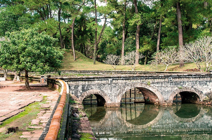 Visit the Tomb of Tu Duc Nguyen Dynasty in Hue - Bridges that lead us to the pine forest