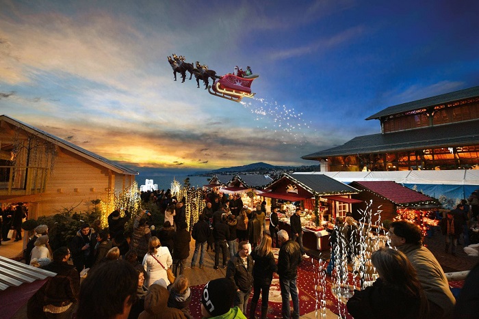 Ông già Noel trên chiếc xe trượt tuyết đang bay ở Chợ Giáng sinh Montreux